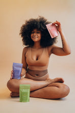Load image into Gallery viewer, Model holding Terra Prima Pink Clay Salt Scrub for Face and Body
